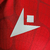 Camisa Crystal Palace I 23/24 - Jogador Macron Masculina - Vermelha e azul com detalhes em branco - CAMISAS DE FUTEBOL | Olé FutStore