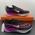 Tênis Nike Zoom Fly 4 - Preto com detalhes em roxo e laranja