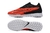 Chuteira Nike Phantom GX Society TF - Vermelha com detalhes em preto e branco - comprar online