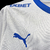 Camisa Universidad Católica I 24/25 - Torcedor Puma Masculina - Branca com detalhes em azul - IMPERIUM SPORTS | LOJA DE ARTIGOS ESPORTIVOS