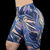 Bermuda fitness legging com estampas coloridas em fundo azul, ideal para treinos.