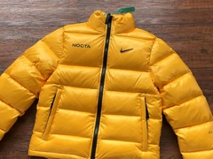 Nocta x Nike Jaqueta Puffer Yellow - comprar online