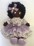 Boneca negra com vestido floral lilás