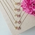 Colar Letra de Microzirconias com Zirconia Quadrada no Dourado com Rosa Claro - comprar online