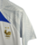 camisa-franca-treino-22-23-torcedor-nike-masculina-branca-com-detalhes-em-azul-e-dourado