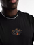 Camiseta semi long oversized VVV world black orange na internet