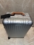 Mala Rimowa Cabin Twist - prata com detalhe em couro caramelo - comprar online