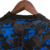 camisa-sevilla-iii-23-24-torcedor-castore-masculina-preto-com-detalhes-em-azul