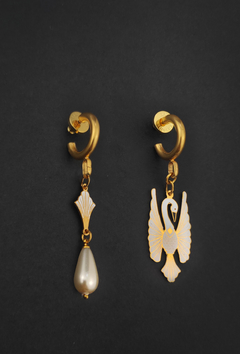 Mini white heron earrings on internet