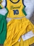 Conjunto de roupa infantil amarelo e verde com a estampa "Brasil 10" em uma blusa e uma saia plissada.