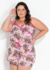 Pijama floral botânico plus size com decote transpassado e alças, em tons de rosa e estampas vibrantes, modelo feminino.