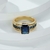 Anillo dorado de eternidad con circonita azul zafiro - comprar online