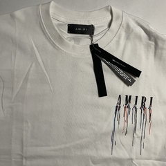 CAMISETA AMIRI “PAINT LOGO DRIP” - Urso Importador