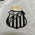 Nova camisa titular do Santos 2024/25 Umbro - Detalhe da Vila Belmiro em embossing, gola Y, detalhes pretos.