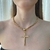 Colar cordão com pingente cruz grande banhado a ouro - comprar online