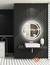 Modern round LED mirror with a luminous halo effect in a stylish bathroom setting.