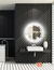 Round LED mirror with luminous glass, featuring a sleek design in a modern bathroom setting.