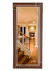 LED mirror with an oak frame, reflecting a staircase and living room interior