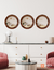 Set of three round oak mirrors on a white wall above a stylish sideboard, featuring a cozy living room setting.