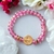 Pulseira Cristal Transparente rosa -medalha dourada