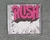 CD - RUSH - THE RUSH REMASTERS - LACRADO