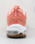 Vista traseira do tênis Nike Air Max SE 97 na cor Apricot Agate, destacando detalhes do design e da sola.