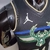 Camiseta regata preta do Milwaukee Bucks, modelo masculino, com logo da Jordan e detalhes em verde e azul.