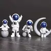 Estátuas Miniaturas de Astronautas - Conj, 4 peças.