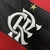 Logotipo do Flamengo em destaque na camisa vermelha e preta, com uma estrela dourada acima.