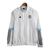 Jaqueta Corta-Vento Manchester United 23/24 - Masculina Adidas - Branca com detalhes em azul e preto