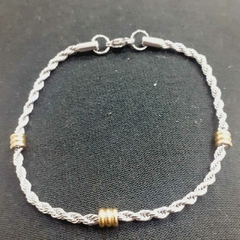 Pulsera torzada acero quirúrjico con detalles en dorado