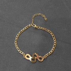 Pulsera de acero quirúrgico dorada con dije de infinito