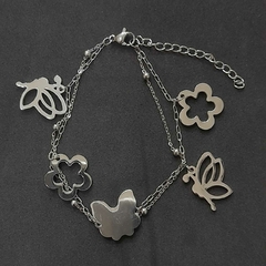 Pulsera de acero quirúrgico con dijes de mariposas y flores