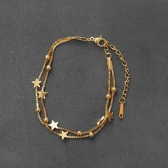 Pulsera de acero quirúrgico Dorado con dijes de estrellas