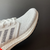 Adidas Ultra Boost 20 White Orange Heel Pattern na internet