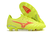 Bright yellow soccer cleats with red accents and a textured sole for enhanced grip.