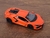 Miniatura Lamborghini Revuelto Kinsmart 1/38 Metal e Fricção Laranja