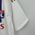 Camisa branca do Olympique Lyonnais para torcedores masculinos, com detalhes em vermelho e azul e logo da Adidas.