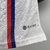 Camisa branca do Lyon I 2023/2024 para jogador masculino da Adidas, com detalhes em vermelho e azul.