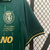 Camisa verde do Sporting Lisboa, edição especial 2024/25, da Nike, com detalhes em dourado e estampas de figuras históricas.