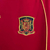 Camisa retrô vermelha da seleção da Espanha, modelo de torcedor masculino da Adidas, com detalhes em amarelo e escudo da equipe.