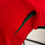 Camisa vermelha da seleção de Portugal, modelo 2024/25, fabricada pela Nike, com logo da marca e emblema da seleção.