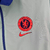 Agasalho corta vento da Nike, modelo Chelsea Dupla Face, na cor azul com detalhes em ciano e logo da equipe.