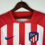 Camisa torcedor masculina do Atlético de Madrid, modelo 2023/2024, nas cores vermelha e branca, com logo da Nike e estampa do patrocinador.