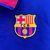 Jaqueta corta vento dupla face do Barcelona, nas cores azul e vermelho, com logo da Nike e do clube.