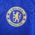 Camisa masculina do Chelsea na cor azul royal, modelo 2023/2024 da Nike, com logo do time e detalhes em branco.