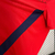 Camisa vermelha do LOSC Lille para torcedores masculinos, modelo 2024/25, com detalhes em azul e logo da New Balance.