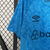 Camisa de treino masculina azul do Grêmio, com detalhes em azul mais escuro e logo da Umbro.

