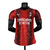 Camisa de jogador masculina do AC Milan 2023/2024 na cor vermelha, com detalhes em preto e logo da Puma.