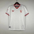 Camisa torcedor masculina branca do Sevilla FC 2023/2024 com detalhes em vermelho.